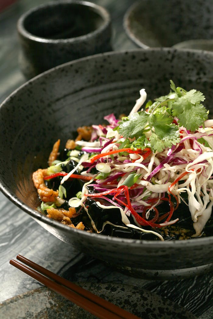 why-choose-us Colorful Asian fusion cuisine with fresh vegetables and noodles, perfect for food photography.